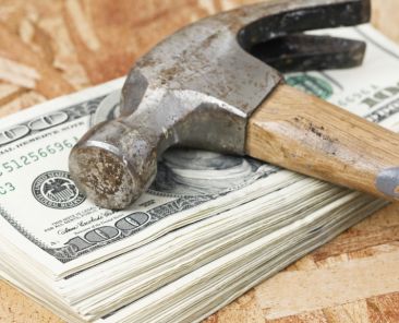 Hammer on Stack of Money